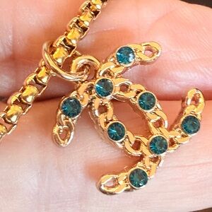 CHANEL authentic Gold stamped zipper pull added to a 15” stainless gold chain